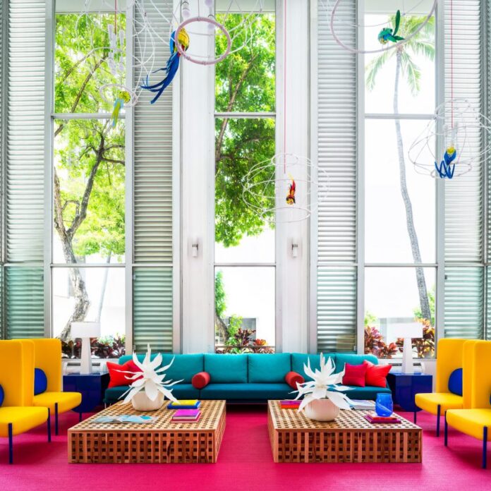 A living room with a magenta pink carpet