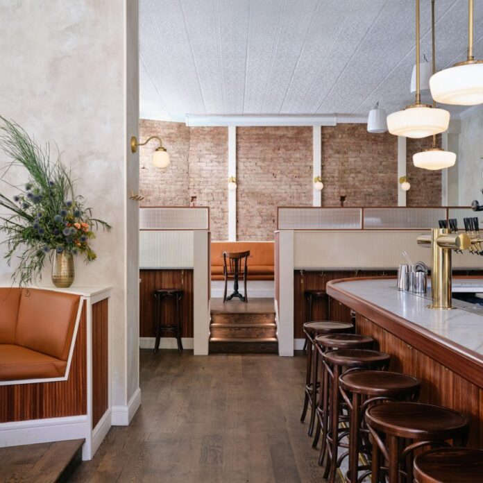 Exposed brick and textured plaster walls at Bar Americano