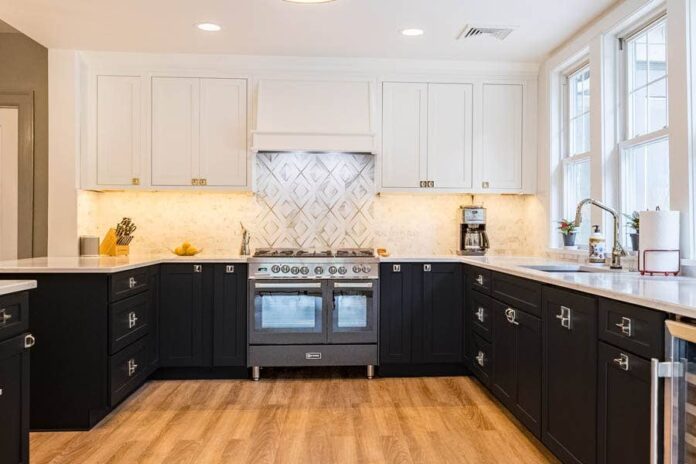 A black and white kitchen using CliqStudios Shaker cabinets, black on the base cabinets and white above.