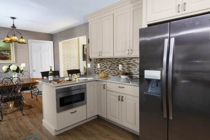 kitchen peninsula surrounded by storage cabinets