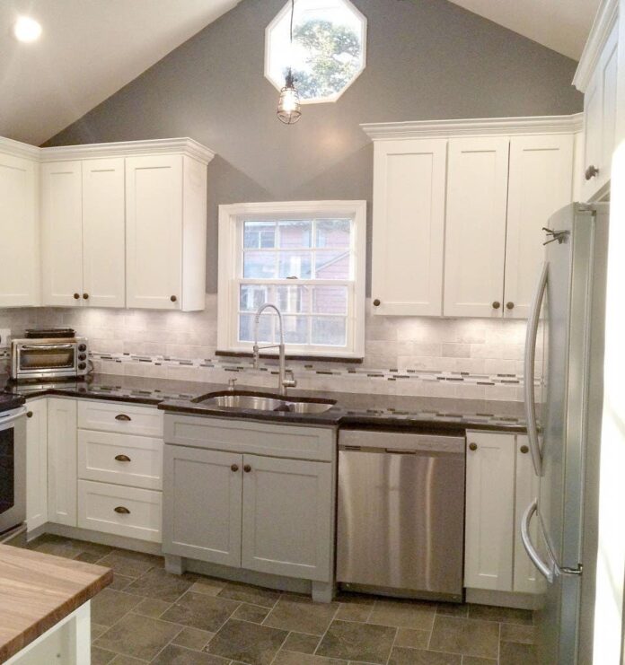 Photo gallery of remodeled kitchen features CliqStudios Shaker Painted White and Gray cabinets