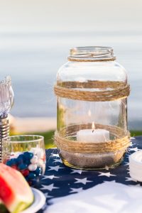 Twine wrapped outdoor candle holder made using a large pickle jar