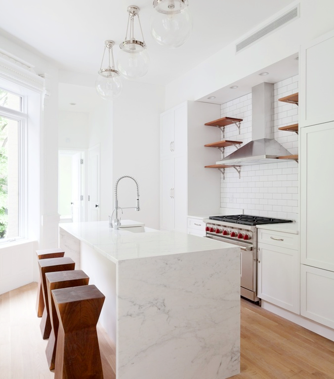 Kitchen island with marble waterfall counter