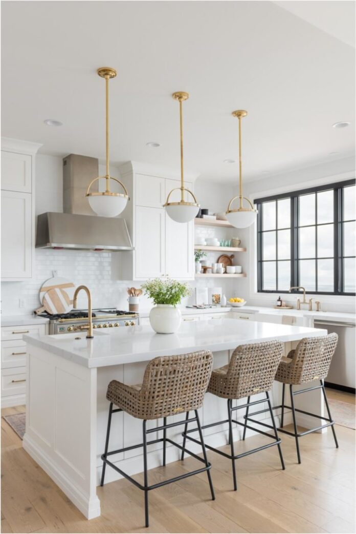 open white kitchen with white island with sink and seating