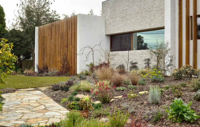 A Textured Melbourne House Woven Into Its Enchanting Gardens