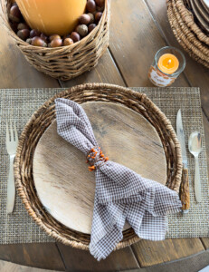 Looking down at a Thanksgiving place setting in a rustic style.