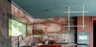 Kingston Lafferty Design includes "sensual" red quartzite kitchen in townhouse renovation