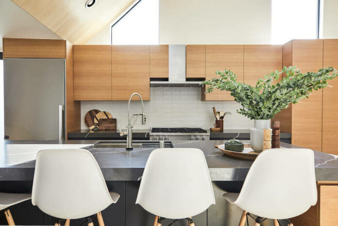 kitchen remodel Los Angeles with black countertop and wood cabinets