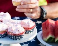 Picnic food set out on a stars and stripes tablecloth