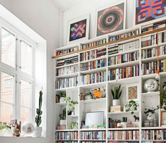 white bookshelves styling with plants